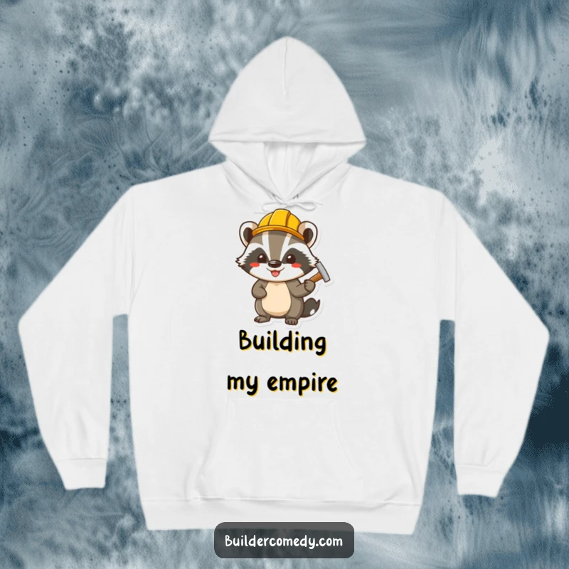 Funny cheerful badger wearing a tiny hard hat, hammering a nail, depicted on a warm and humorous hoodie.